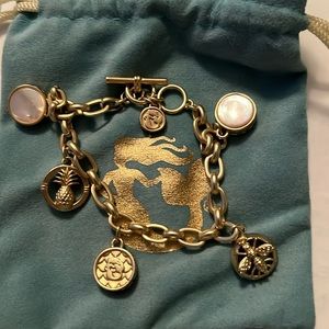 Spartina charm bracelet in gold with toggle clasp.